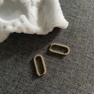 Twisted gold hoop earrings